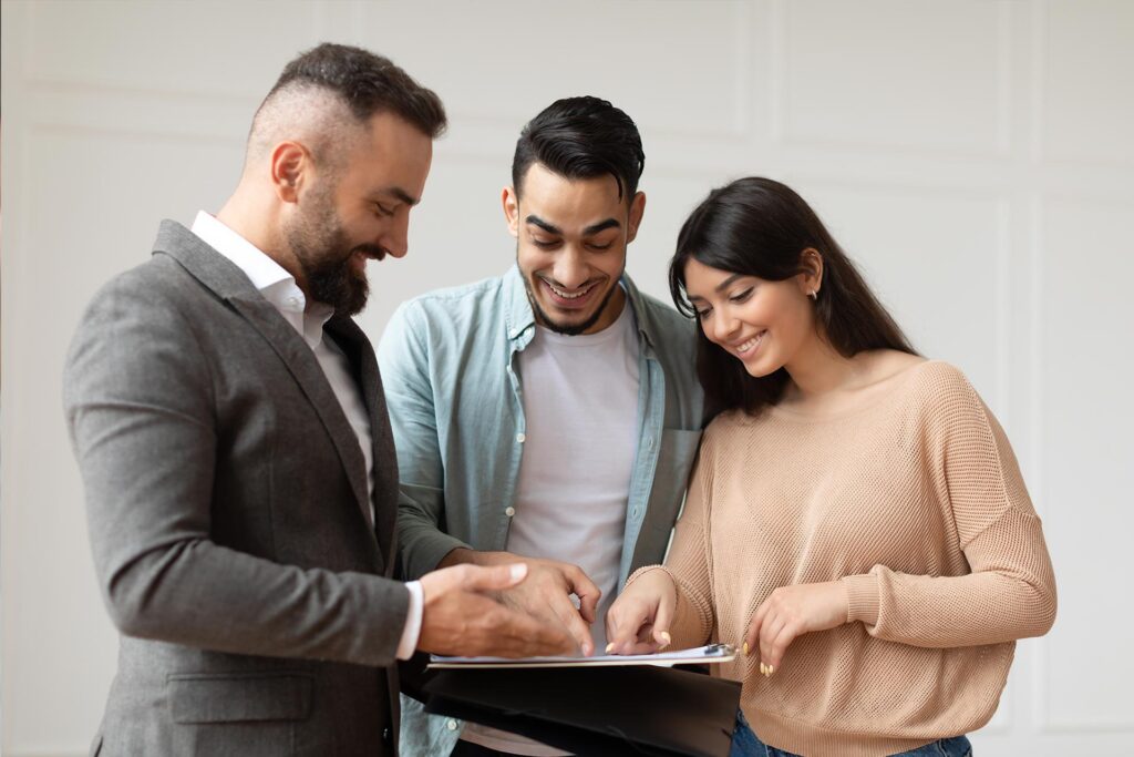 couple-buying-new-apartment-house-agent-showing