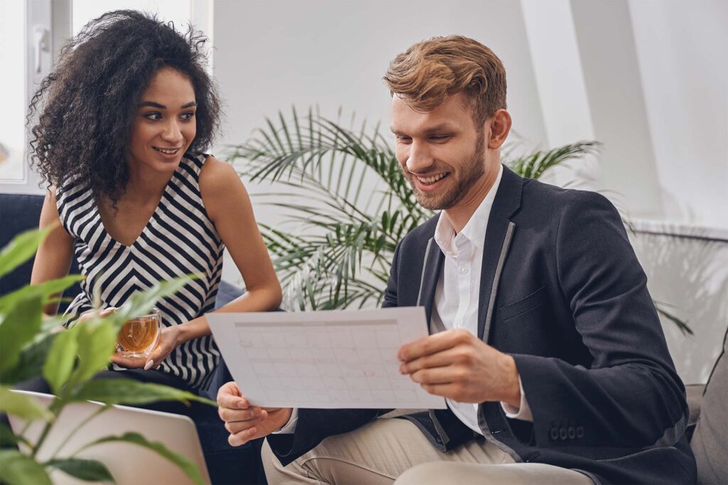 smiling-business-lady-looking-at-her-colleague